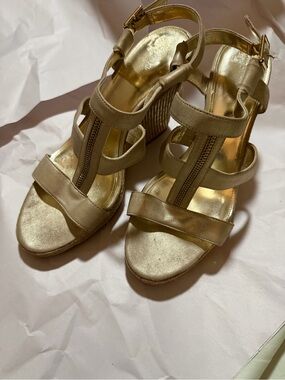 Calvin Klein ‘Emmah’ Gold Wedge Espadrilles.